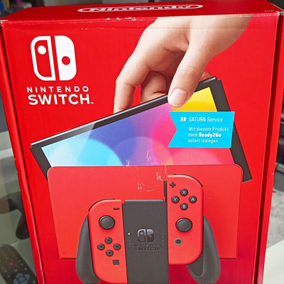 Nintendo Switch (OLED Model) Konsole 64 GB Rot/Schwarz inkl. OVP