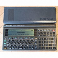 SHARP PC-E500 pocket computer with cover
