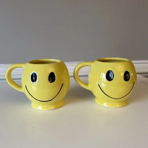 Two 2 1970s McCoy Pottery Smiley Face Mugs Light Yellow