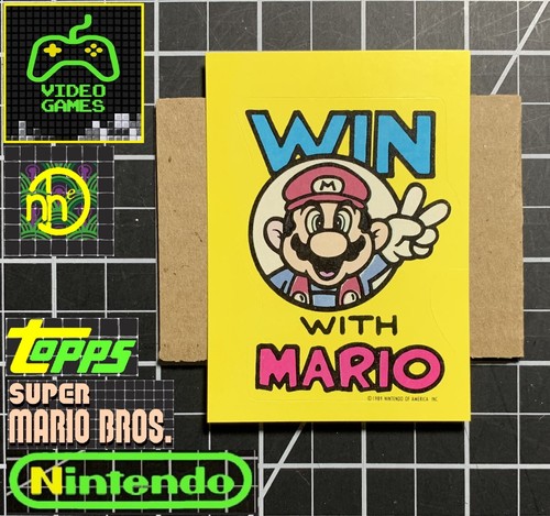 1989 Topps Nintendo Game Packs - Pegatina GT18 Gana con Mario - LIMPIO - Imagen 1 de 4