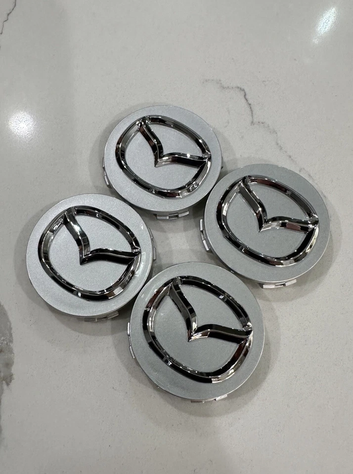 (4 X) Tapacubos centrales de rueda plateados MAZDA 56 mm Mazda 3/5/6, RX 8, Miata, CX-3/5/7/9 Foto 2 de 3