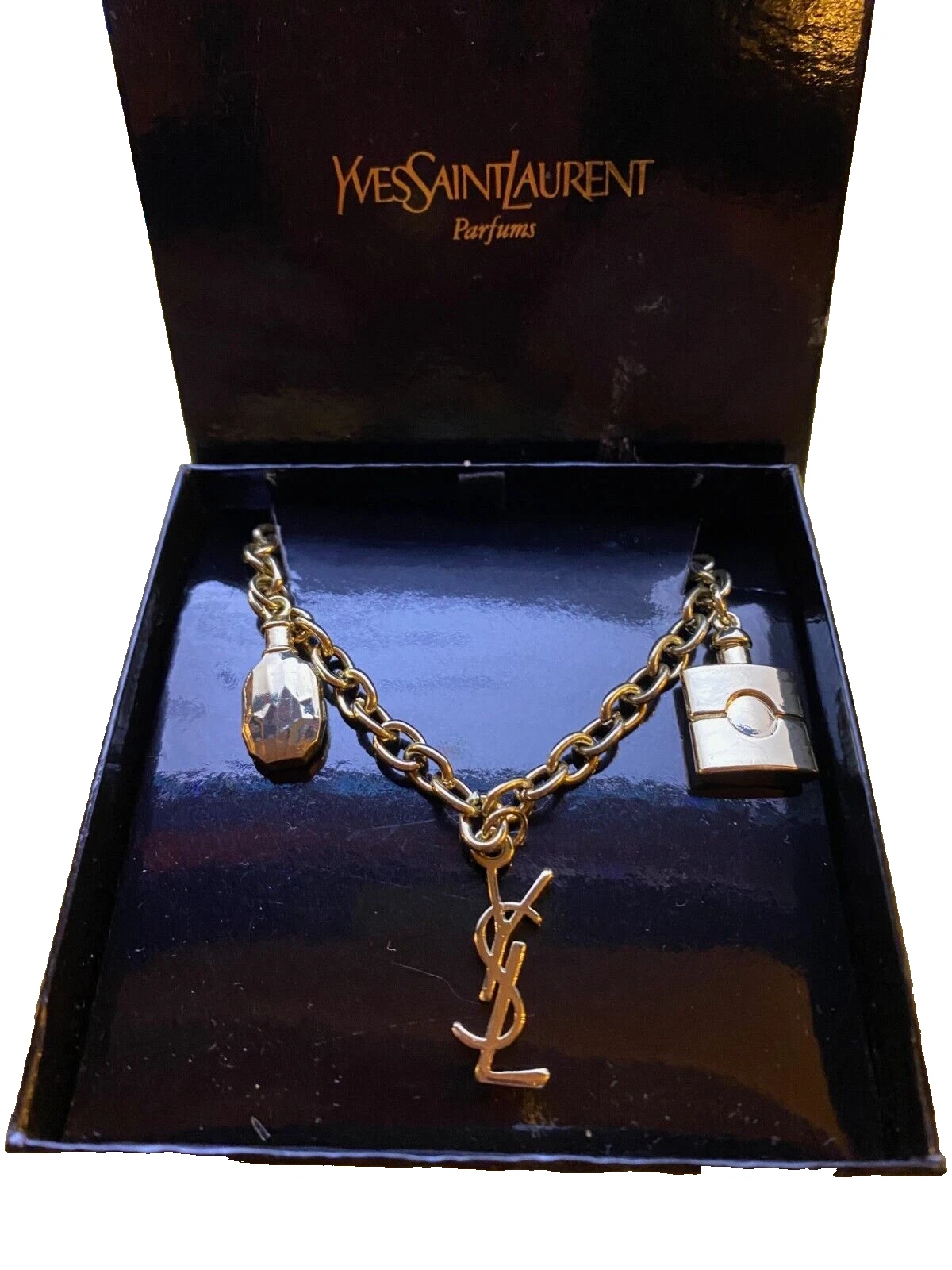 SAINT LAURENT (YSL) Bracelet 3 pampilles métal doré Yves Saint Laurent 3 charms YSL G tone