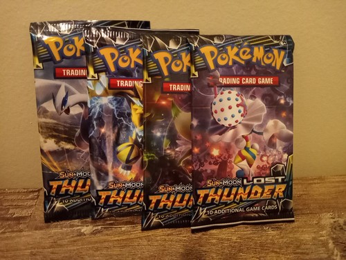 Pokemon 4x S&M Lost Thunder Booster Packs Factory Sealed - All 4 Art Sets! - Picture 1 of 2
