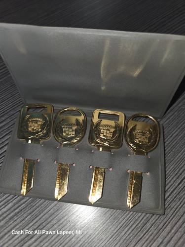 Set of 4 uncut Gold Cadillac Keys grey gray sleeve vintage new auto parts - Picture 1 of 4