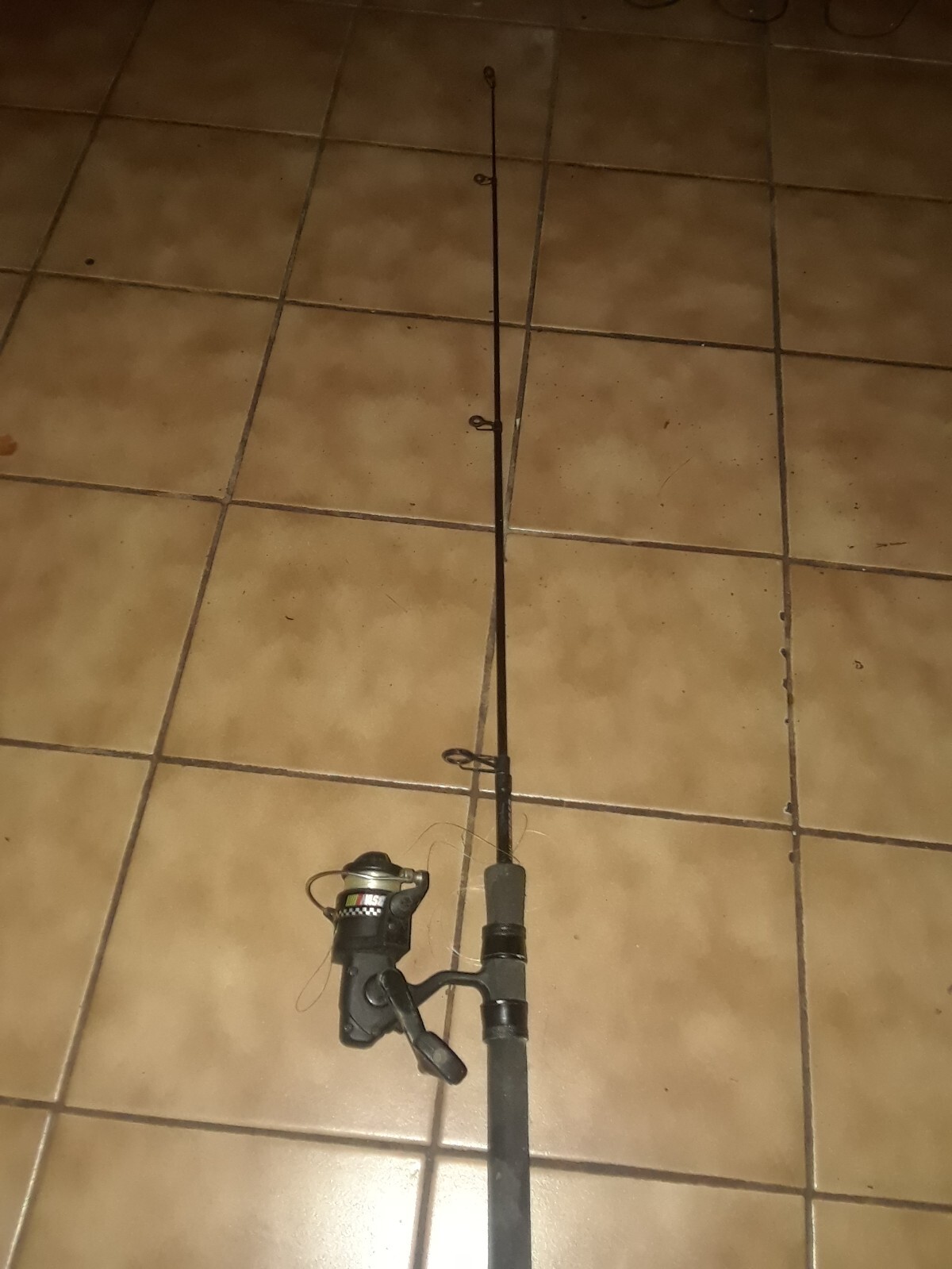 NASCAR fishing pole and Shakespeare reel 48" total length