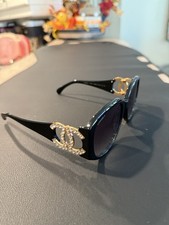 Chanel Women  s Black Sunglasses with Gold Crystal Logo Accent With Case