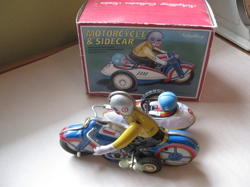Tin Toy Schylling Motorcycle with sidecar, works, original box.