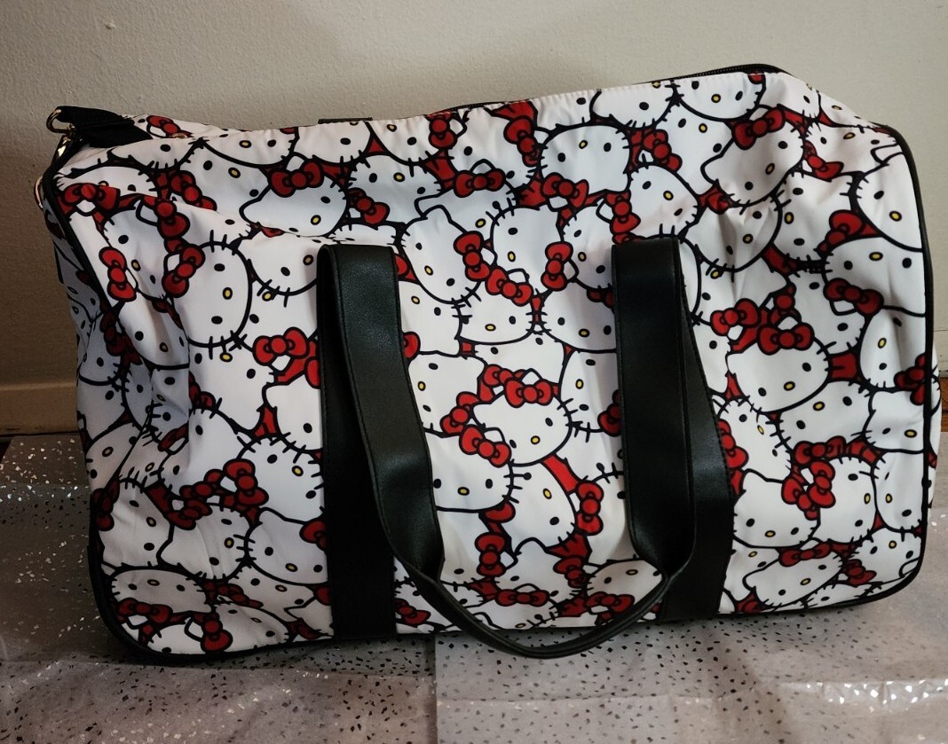 HELLO KITTY PINK ROLLING LEATHER DUFFEL LUGGAGE BAG/SUITCASE NWT