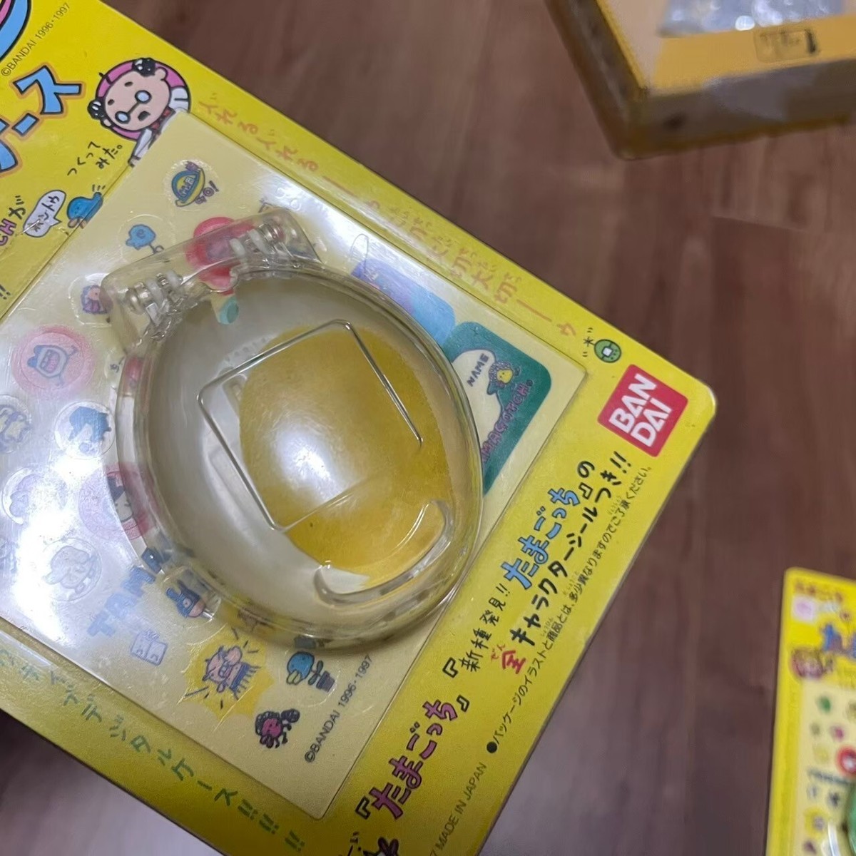 New Yellow Bandai Tamagotchi Official Clear Egg Case + New Species