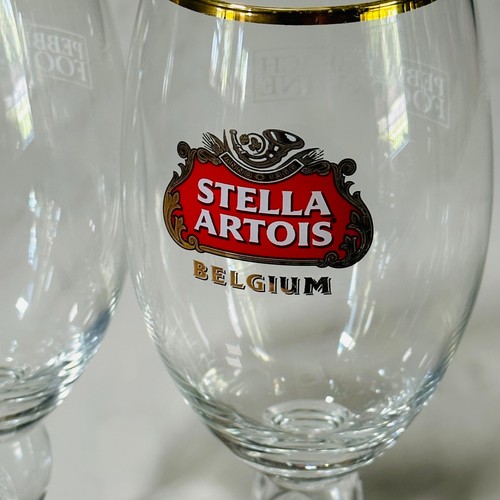 Stella Artois Calice Belgio Set 2 Bicchieri Birra Ciottoli Spiaggia Enogastronomia - Foto 2 di 6