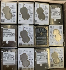 Lot Of 2 Random Hard Drives - 2.5 in (1TB) *FOR PARTS* - READ DESCRIPTION