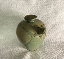Vintage vase, featuring a frog design, used as a bud vase or a spill vase. 