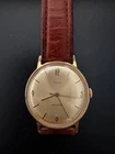 A Vintage 1964 Timex Men's Gold Tone Manual Wind Wristwatch.