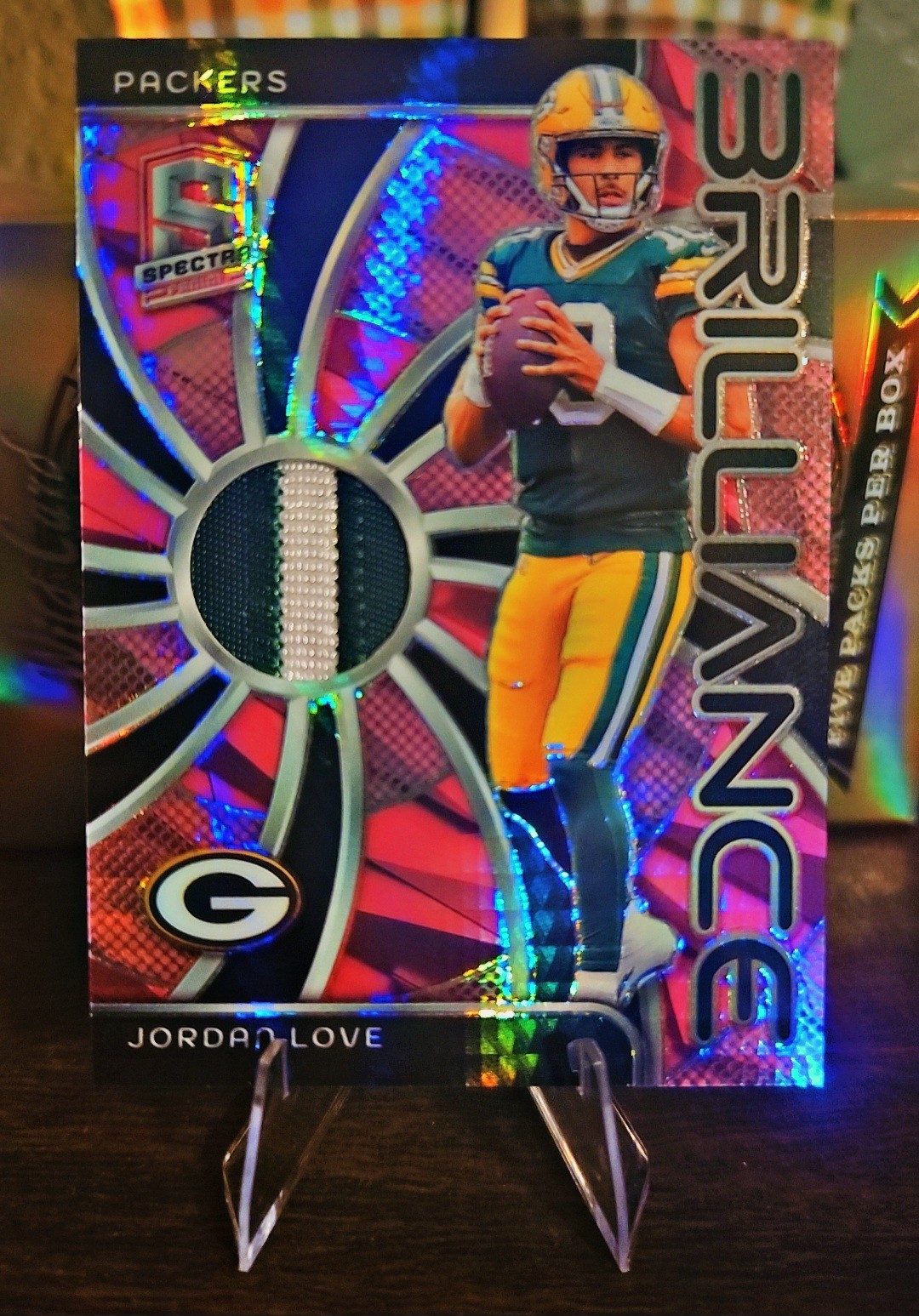 2024 Panini Spectra - Brilliance Jordan Love #BRI-6 Neon Pink Prizm /15 (MEM)