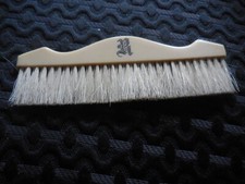 Vintage Clothes Brush cream color with letter R, not sure of material, has lines
