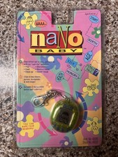 VTG NANO BABY Gold Digital Virtual Pet Playmates 1997 RARE Sealed