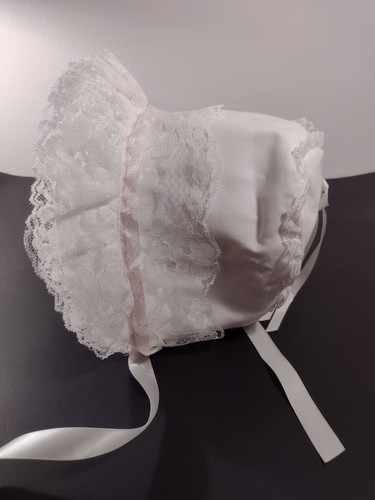 #11 Baby bonnet 12-18 mos size 15 lacey, white ribbon and bow, pink trim,