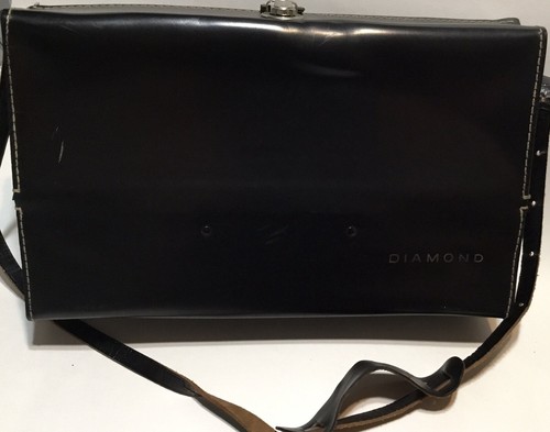 Black leather shoulder bag with white stitching, clasp, and “Diamond” logo on textured front panel.