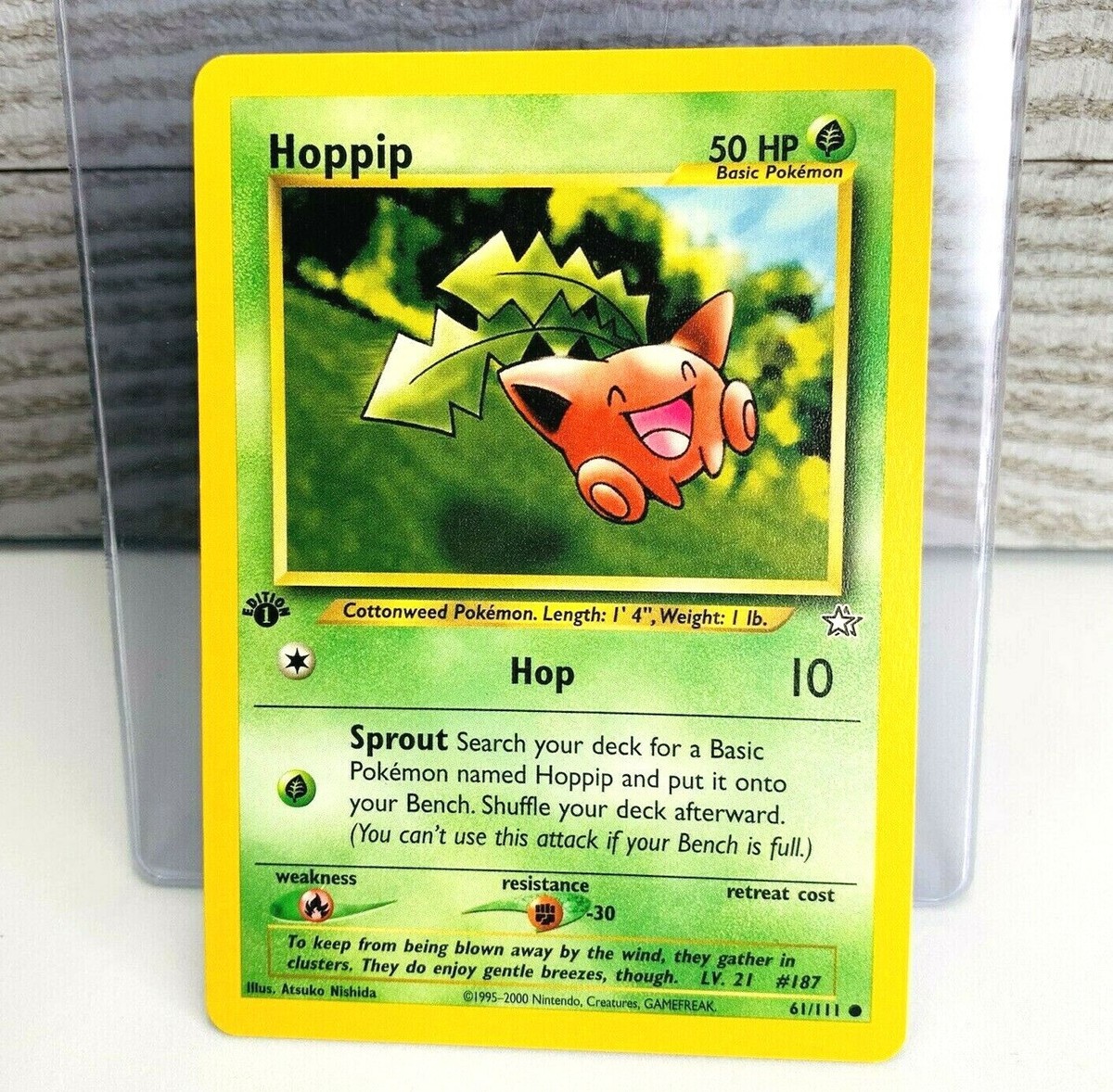 1st Edition Hoppip 61/111 Neo Genesis Pokemon Card Ex/Light