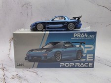 Pop Race 1:64 Mazda RX7 RE Amemiya Widebody Blue Chrome with Carbon Top PR640223