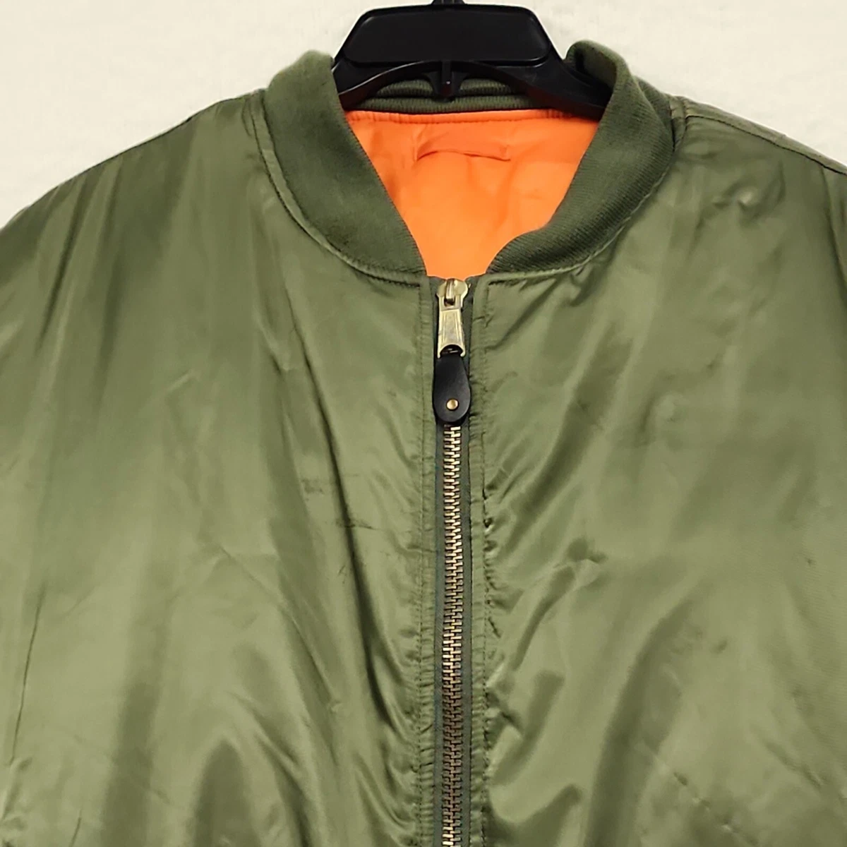 Olive green bomber jacket with orange inside sale