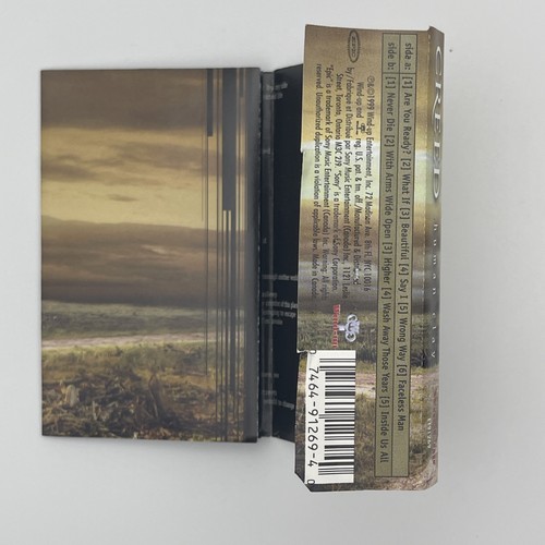 Cassette de arcilla humana Creed 1999 de colección con brazos abiertos cuerda usado - Imagen 5 de 5
