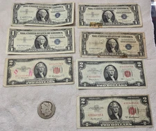 Silver Certificates,  Red Seals, and a Silver Dollar - well circulated