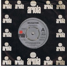 Delegation - Put A Little Love On Me (7", Single, Com)