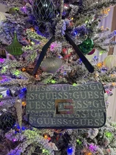 Guess denim handbag with all-over logo print.