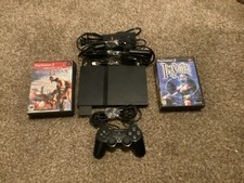 Sony PlayStation 2 Slim Bundle Complete with games, memory card, and cables