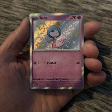 Ralts 153/091 Sv: Paldean Fates Holo