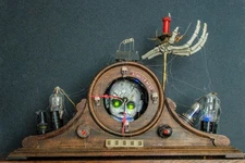 Halloween Mantel Clock-Radio (faux) with Shrunken Head & Glowing Emerald Eyes