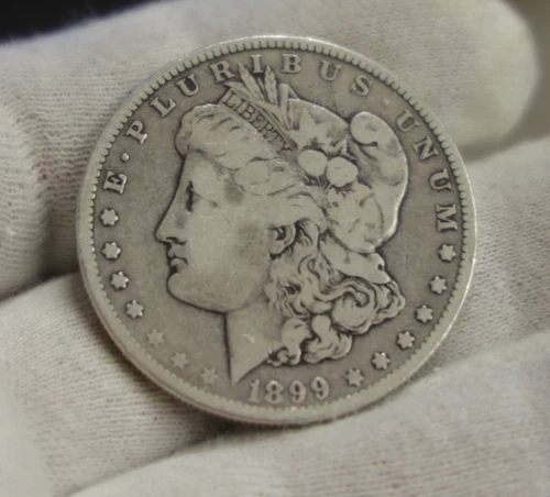 1899 O US Morgan Silver Dollar $1 VG (Cleaned)