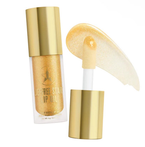 Jeffree Star Olio Labbra Autoprodotto Trasparente con Glitter Oro - Foto 1 di 2