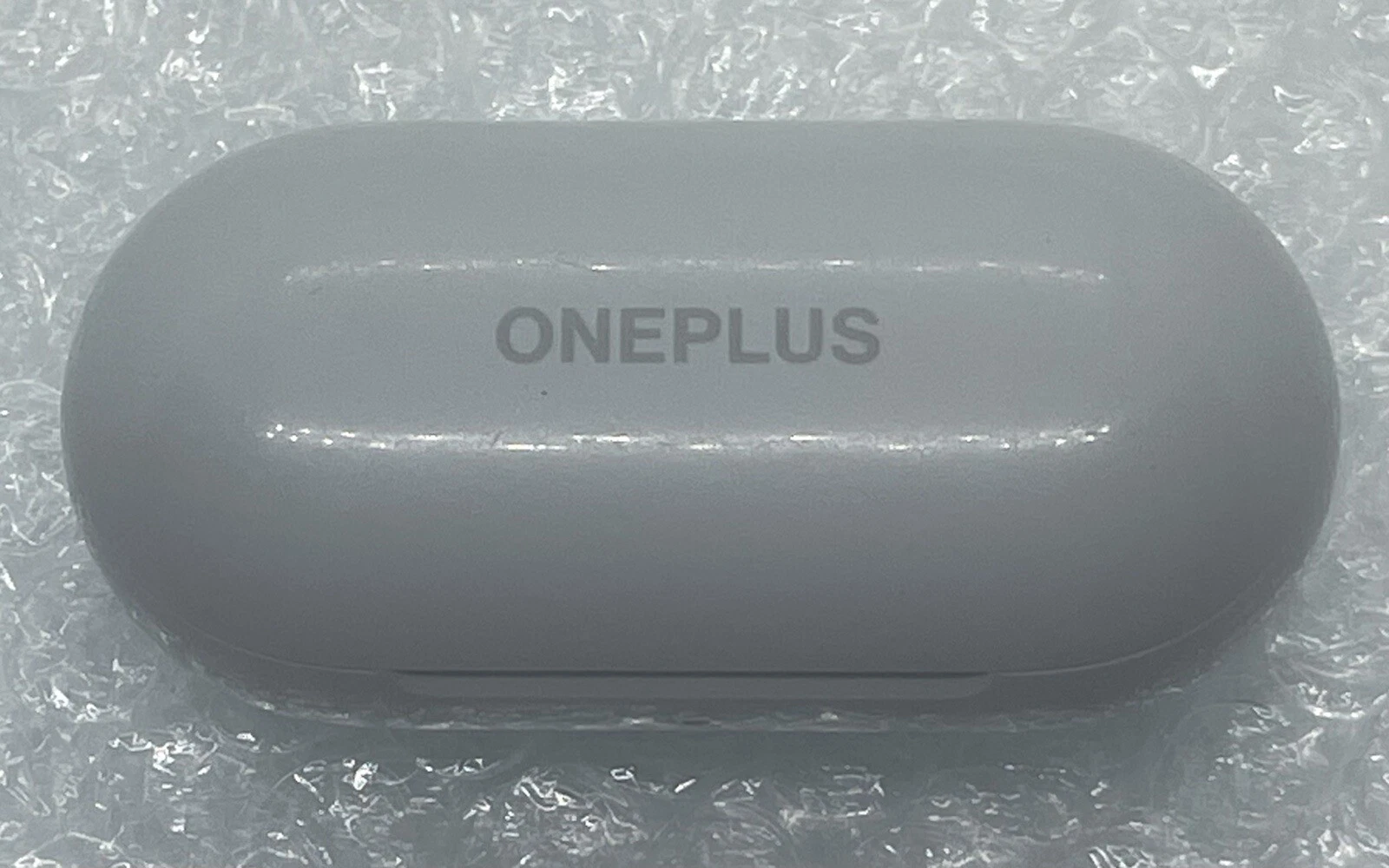 OnePlus Buds Z Silver Bass Wireless Bluetooth Charging Case and Right earbud