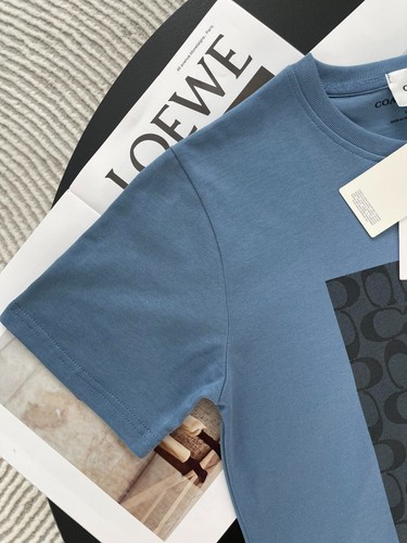NUEVO CON ETIQUETAS COACH Hombre Mujer Unisex AZUL Y AMARILLO Snoopy Camiseta ALGODÓN - Imagen 9 de 11