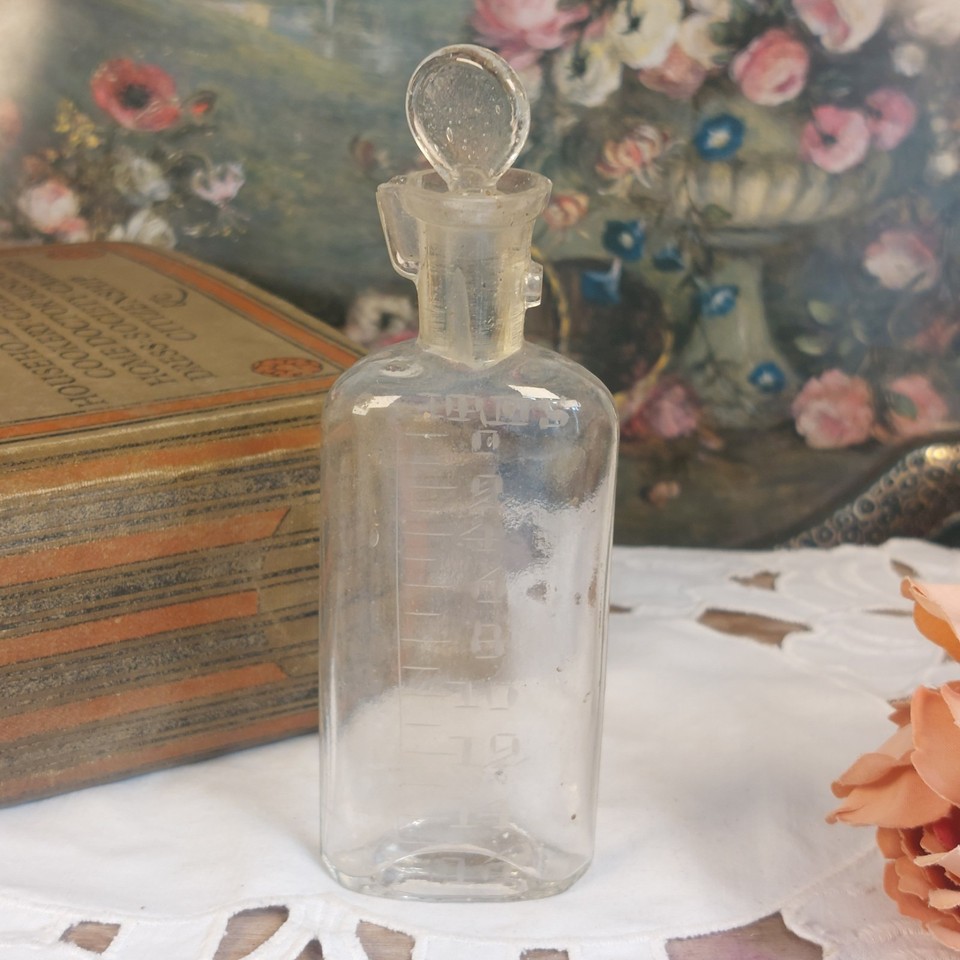 A genuine c.1920 glass chloroform dropping bottle with etched labeling — a hauntingly beautiful piece of medical history that doubles as a gothic curiosity display item.