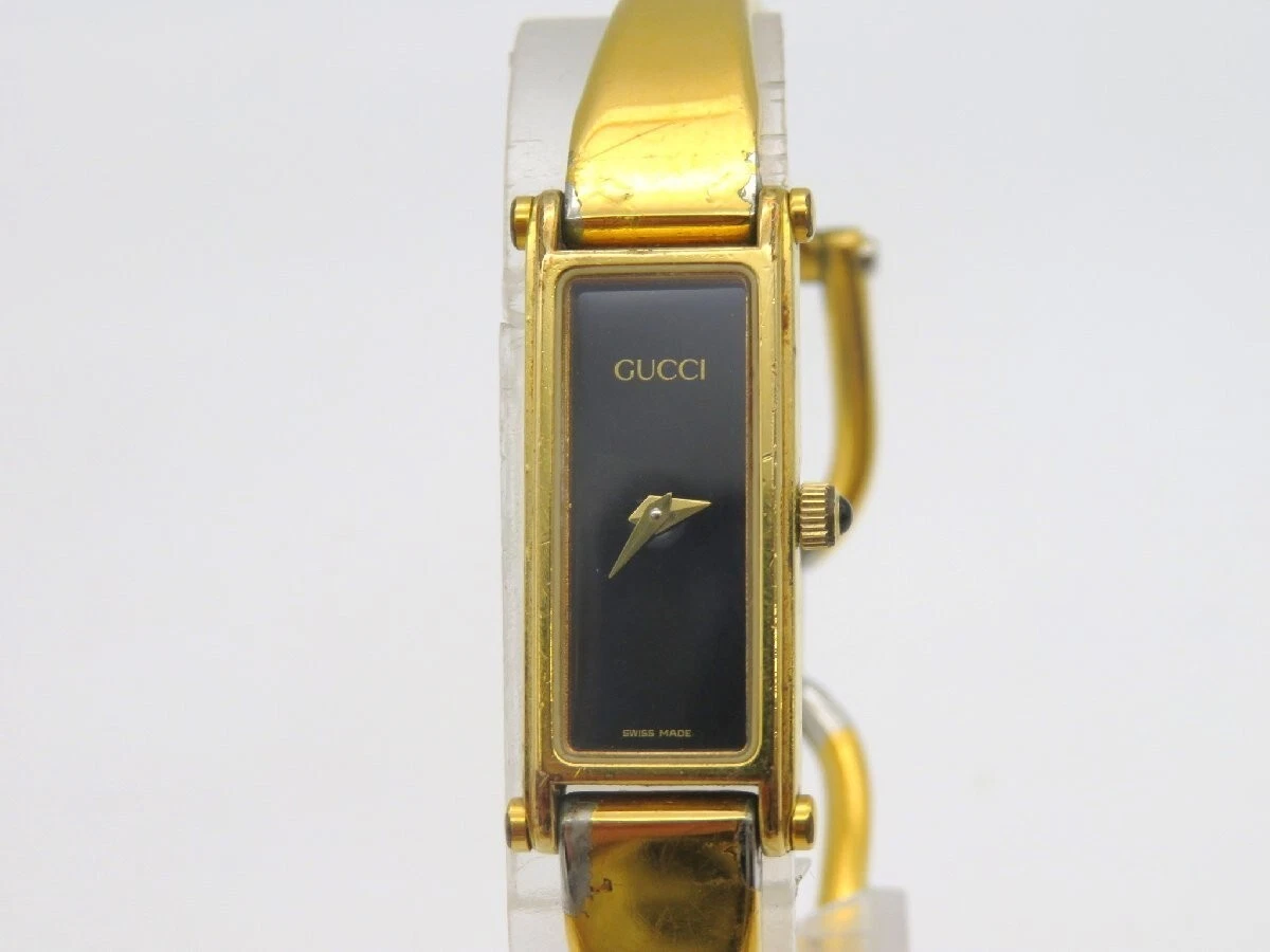 Montre bracelet pour femme GUCCI 1500 cadran doré noir QZ occasion fonctionne F/S