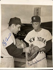 YOGI BERRA AND ELSTON HOWARD PERFECTLY SIGNED 8 X 10 UPI PHOTO WITH JSA LETTER.