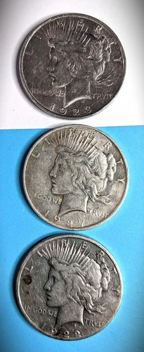 1923 Peace Dollar and two more - 1927-D 1922-S - Three Lot sale.