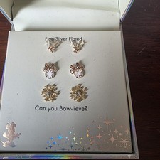 New In Box Disney two-tone crystal Minnie Mouse and snowflake stud earring set.