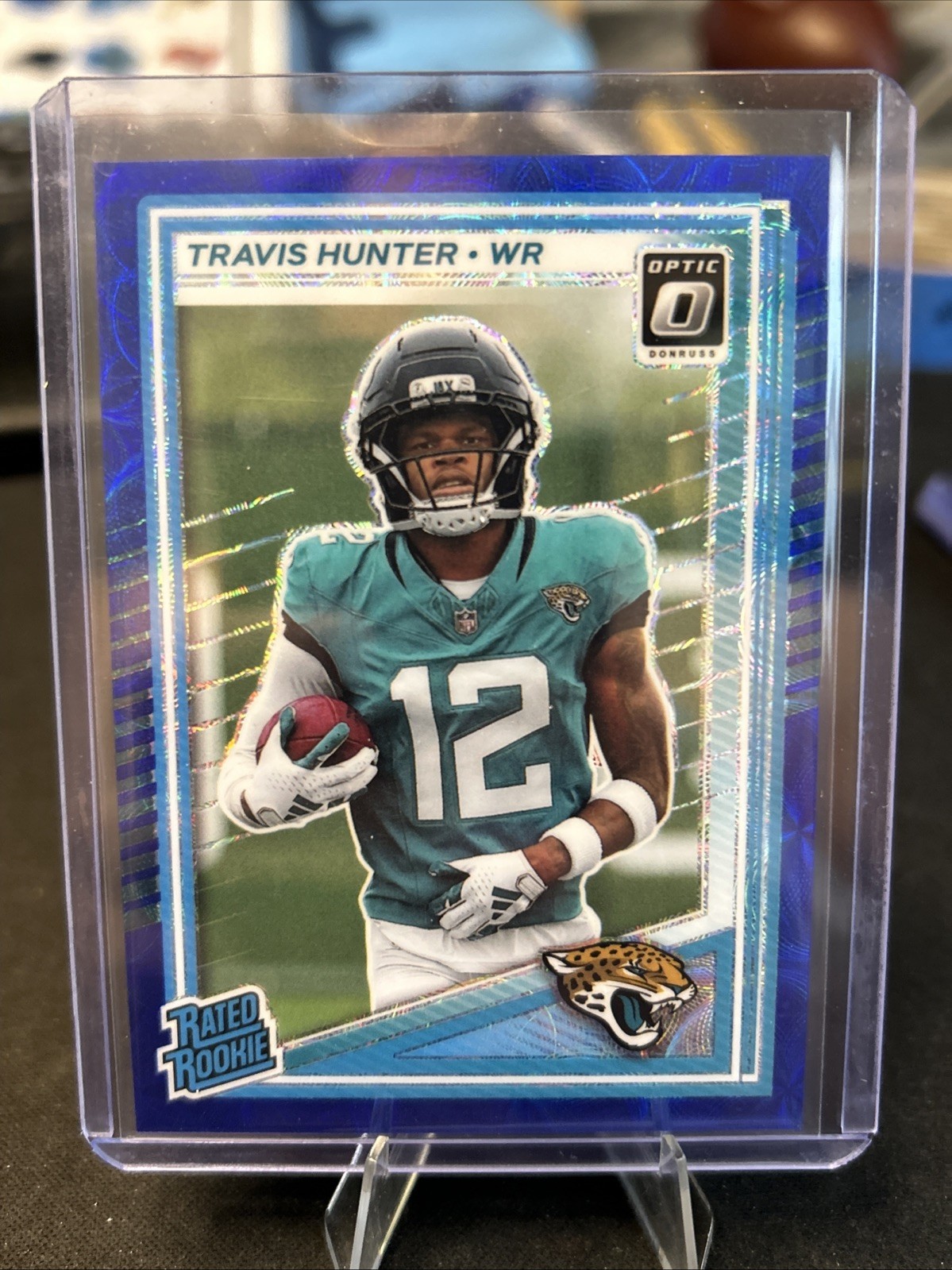 2025 Donruss Optic Football #201 Travis Hunter Blue Scope Rated Rookie