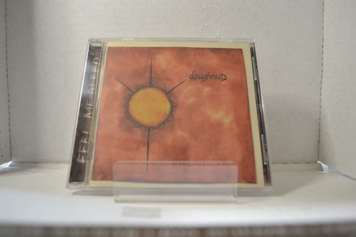 DOUGHNUTS - Feel Me Bleed - CD Like New. - Picture 1 of 3