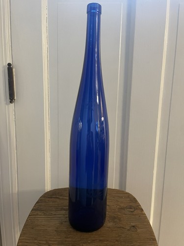 Vintage cobalt blue 19 in Bottle dragonflies edged in the glass