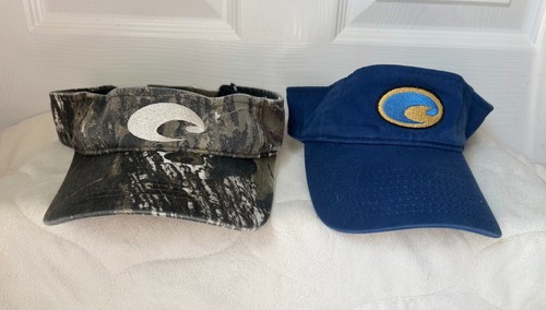 Two Costa Del Mar Visors one camo the other blue