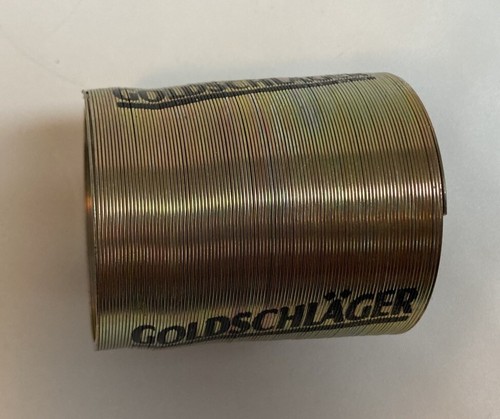 vintage Goldschlager branded Metal Slinky Toy Marketing Decor Man Cave Bar 2" - Picture 3 of 6