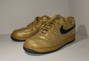 gold nike air force ones