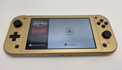 Nintendo Switch Lite Console Hyrule Edition Gold Zelda W carrying