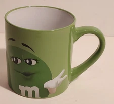 M&M'S MARS GREEN CANDY ADVETISING CHARACTER CERAMIC COFFEE MUG I MELT FOR NO ONE
