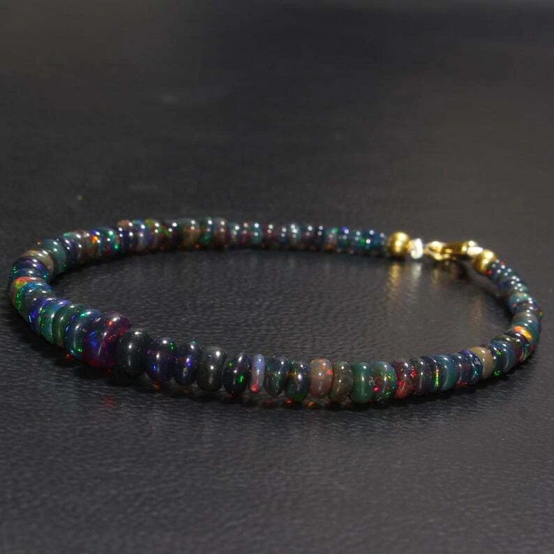Brazalete de piedras preciosas con cuentas rondelle lisas de ópalo de fuego negro etíope natural de 3-5 mm Foto 2 de 4